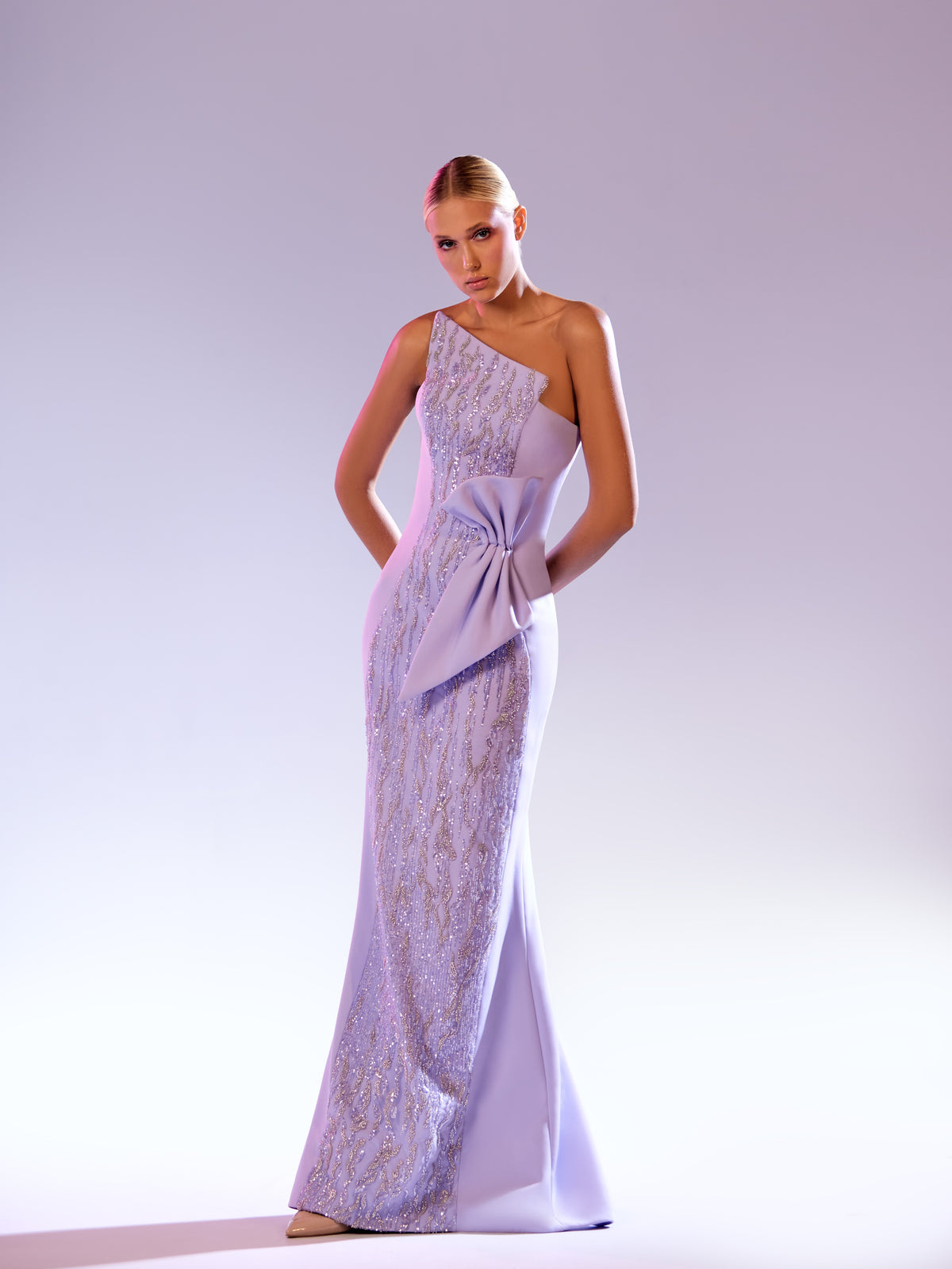 Abdo Aoude — dusty violet one-shoulder gown with embroidery and bow at the hip, front view