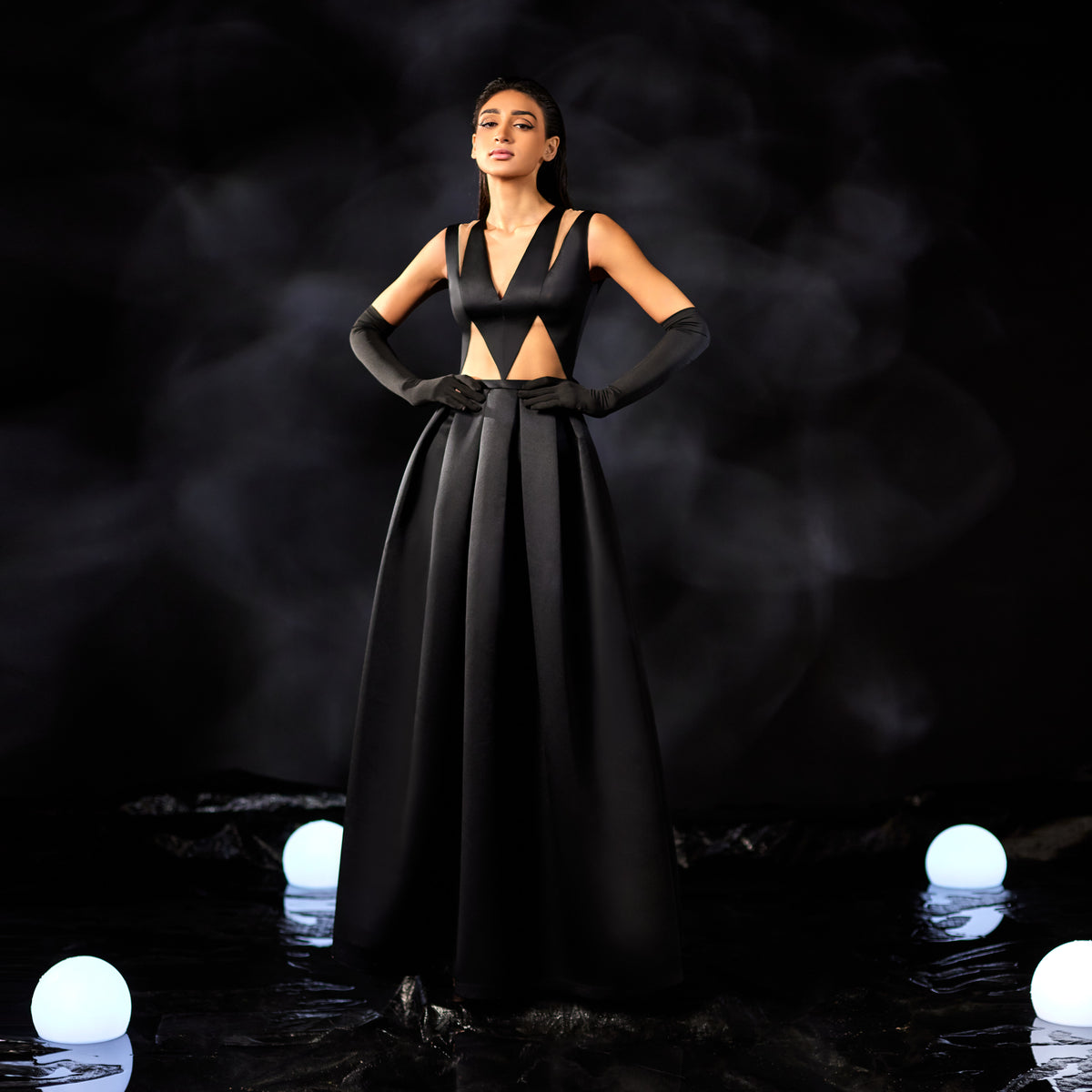 Abdo Aoude — black cutout bodice gown with pleated ball skirt, front view